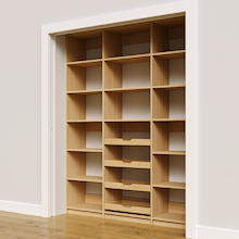 Four wood pull-out drawers in 69 inch natural oak pantry shelving.