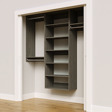 Grey 70.5-inch woodgrain Vista Total Closet Kit, angled view, empty, with tall hanging in a reach-in closet