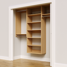 Natural oak 70.5-inch woodgrain Vista Total Closet Kit, angled view, empty, with tall hanging in a reach-in closet