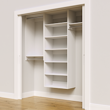 White 70.5-inch Vista Total Closet Kit, angled view, empty, with tall hanging in a reach-in closet