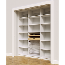 Two wood pull-out drawers and two pull-out wire baskets in a 72 inch white built-in pantry for reach-in storage.