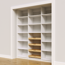 Four wood pull-out drawers in a 72 inch white pantry for reach in storage.