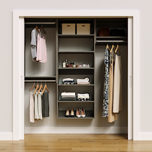 Grey 73.5-inch woodgrain Vista Total Closet Kit, front view in a reach-in closet, holding dresses