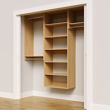 Natural oak 73.5-inch woodgrain Vista Total Closet Kit, angled view, empty, with tall hanging in a reach-in closet
