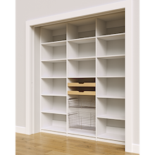 Adjustable shelving layout with two wood drawers and two pull-out wire baskets in a 75 inch white pantry.