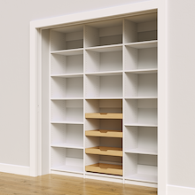 Adjustable shelving layout with four wood drawers in a 75 inch white pantry.