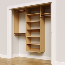 Natural oak 76.5-inch woodgrain Vista Total Closet Kit, angled view, empty, with tall hanging in a reach-in closet