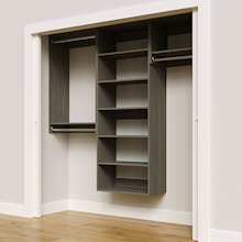 Grey 79.5-inch woodgrain Vista Total Closet Kit, angled view, empty, with tall hanging in a reach-in closet