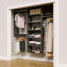 Grey 79.5-inch woodgrain Vista Total Closet Kit in a reach-in closet with dresses, shoes, and handbags