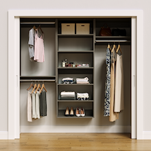 Grey 79.5-inch woodgrain Vista Total Closet Kit, front view in a reach-in closet, holding dresses