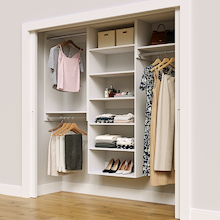 White 79.5-inch Vista Total Closet Kit in a reach-in closet with dresses, shoes, and handbags