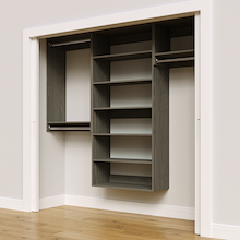 Grey 85.5-inch woodgrain Vista Total Closet Kit, angled view, empty, with tall hanging in a reach-in closet