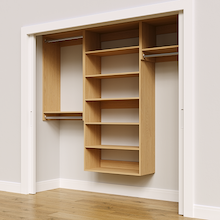Natural oak 85.5-inch woodgrain Vista Total Closet Kit, angled view, empty, with tall hanging in a reach-in closet