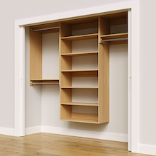 Natural oak 88.5-inch woodgrain Vista Total Closet Kit, angled view, empty, with tall hanging in a reach-in closet