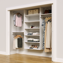 White 88.5-inch Vista Total Closet Kit in a reach-in closet with dresses, shoes, and handbags