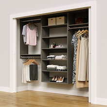 Grey 91.5-inch woodgrain Vista Total Closet Kit in a reach-in closet with dresses, shoes, and handbags