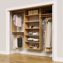 Natural oak 91.5-inch woodgrain Vista Total Closet Kit in a reach-in closet with dresses, shoes, and handbags