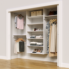 White 91.5-inch Vista Total Closet Kit in a reach-in closet with dresses, shoes, and handbags