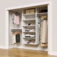 White 94.5-inch Vista Total Closet Kit in a reach-in closet with dresses, shoes, and handbags