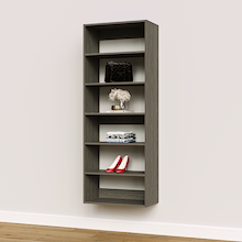 Grey 25.5 inch shelf tower for folded t-shirts and jeans in an apartment wardrobe.