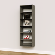 Grey 22.5 inch shelf tower for organizing folded sweaters in a dressing room.