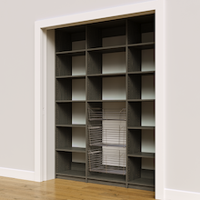 Three pull-out wire baskets in 69 inch grey kitchen pantry shelving.
