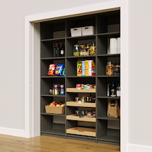 Modern grey 72 inch reach in pantry with four sliding wood drawers.