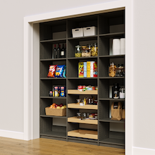 Modern grey 75 inch pantry rack with four wood pull-out drawers.