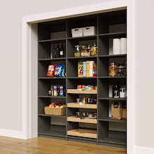 Grey 78 inch pantry shelving with four wood pull-out drawers.