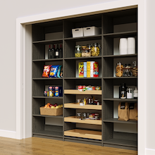 Grey 90 inch reach in pantry shelving featuring four sliding wood shelves.