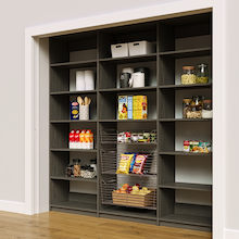 Grey 90 inch reach in pantry shelving featuring three sliding wire baskets.