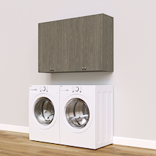 Grey Basic Laundry Kit featuring upper storage doors installed above a washer and dryer to keep laundry supplies within easy reach. Yes