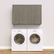 Grey Basic Laundry Kit with storage doors and overhead shelving installed above a washer and dryer providing built-in laundry room storage. Yes