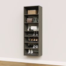Grey shoe organizer featuring 4 slanted shelves for mixed footwear storage in a bedroom closet.