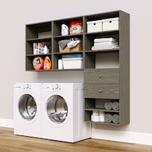 Grey Choice Laundry Kit with a shelf tower with two drawers and overhead shelving installed above a washer and dryer for organized laundry room storage.