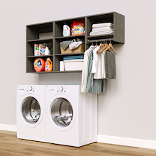 Grey Classic Laundry Kit with a hanging rod and overhead shelving installed above a washer and dryer for organized laundry room storage.