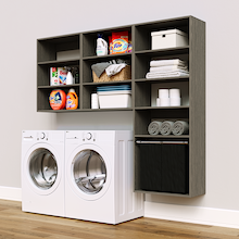 Grey Select Laundry Kit with a shelf tower with a pull-out hamper and overhead shelving installed above a washer and dryer for organized laundry room storage.