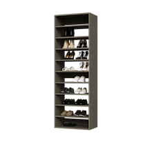 Grey shoe tower with 10 straight shevles for daily footwear storage in a studio apartment closet.