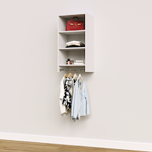 White medium hanging closet module with folded clothing on three upper shelves and garments on a hanging rod below.