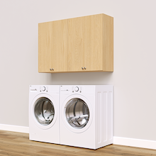 Natural Oak Basic Laundry Kit featuring upper storage doors installed above a washer and dryer to keep laundry supplies within easy reach. Yes