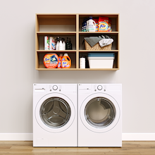 Natural Oak Basic Laundry Kit featuring open overhead shelves installed above a washer and dryer to organize everyday laundry essentials. No