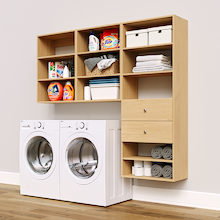 Natural Oak Choice Laundry Kit with a shelf tower with two drawers and overhead shelving installed above a washer and dryer for organized laundry room storage.