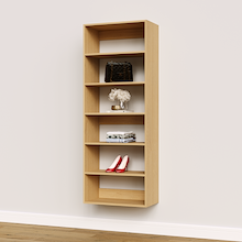 Natural oak 25.5 inch shelf tower inside a master walk-in closet.
