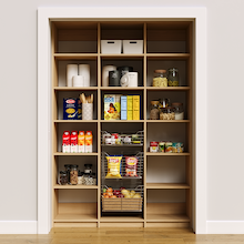 57 inch natural oak pantry shelves for organizing grocery dry goods.
