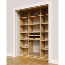 Close up of two wood pull-out drawers and two pull-out wire baskets in a 66 inch natural oak pantry.
