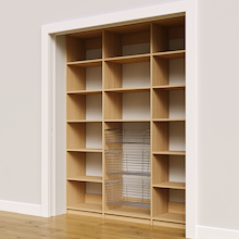 Three chrome pull-out baskets in a 69 inch natural oak pantry unit.