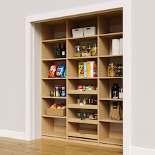 Natural oak 72 inch reach in pantry shelves with four wood pull-out drawers.