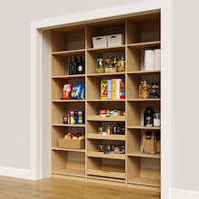 Natural oak 75 inch pantry shelving with four wood drawers for storage.