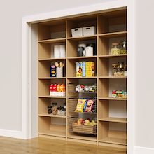 Reach in pantry racks in natural oak with 78 inch width and three wire baskets.