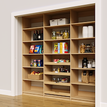 Natural oak 90 inch reach in pantry shelving with four sliding wood pull-out drawers.